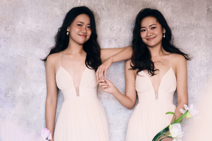 Press photo: the duo in pale dresses